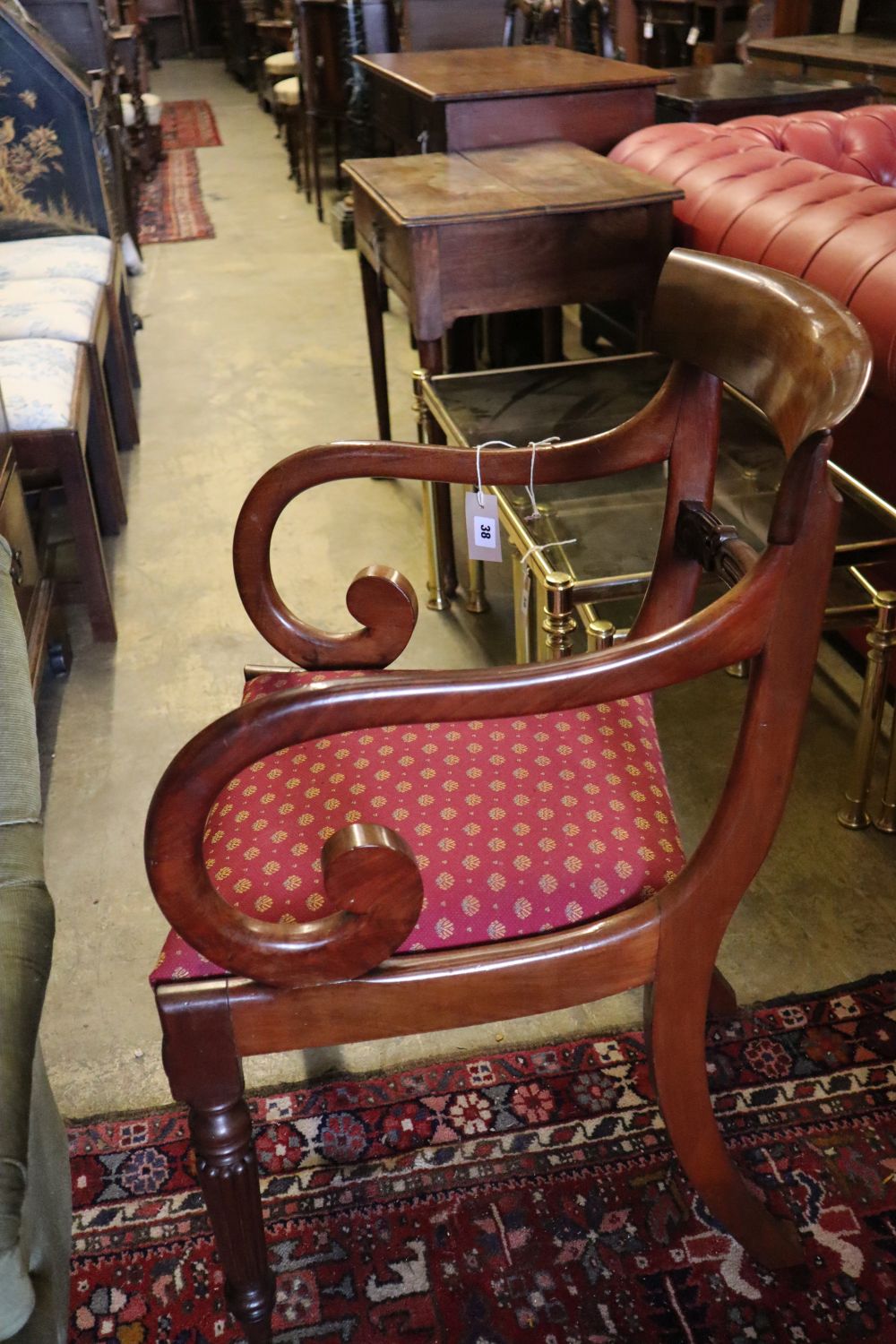 A William IV scroll arm elbow chair